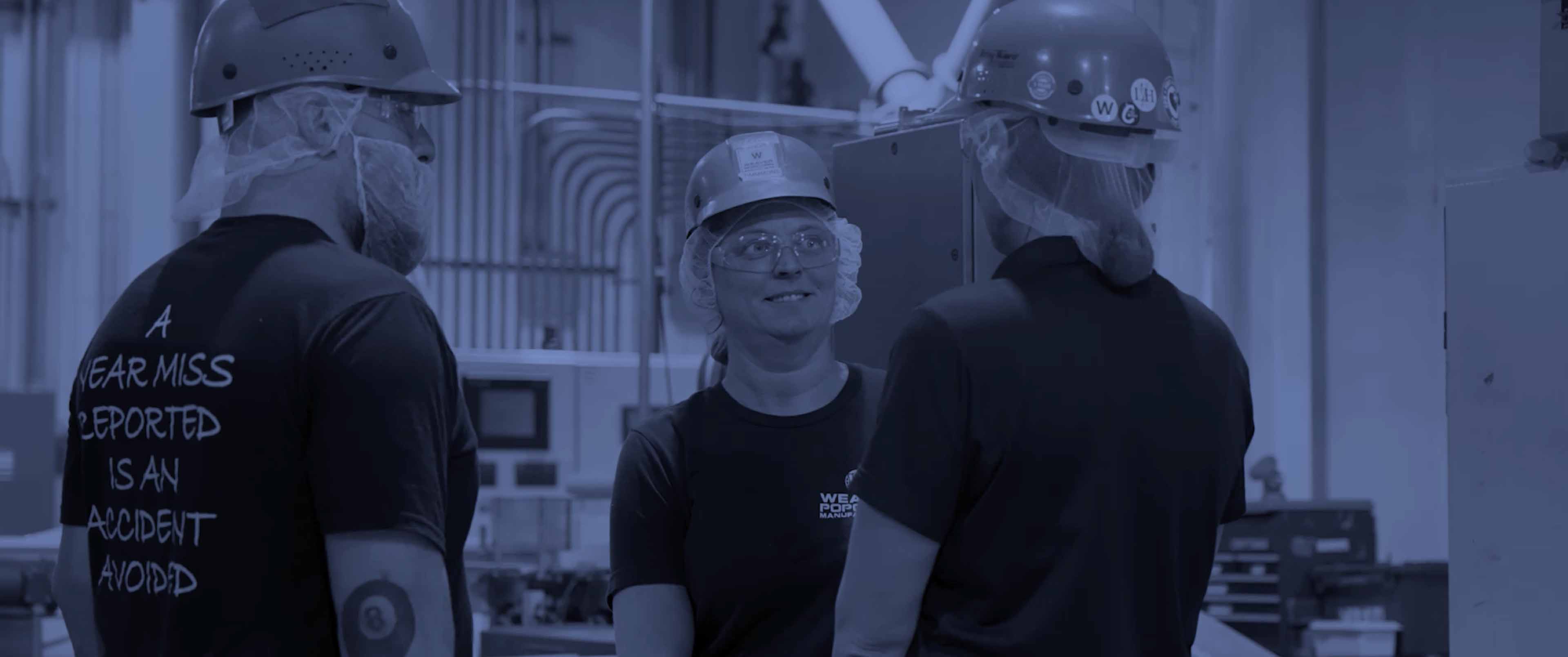 A small wooden bowl of popcorn on a table.