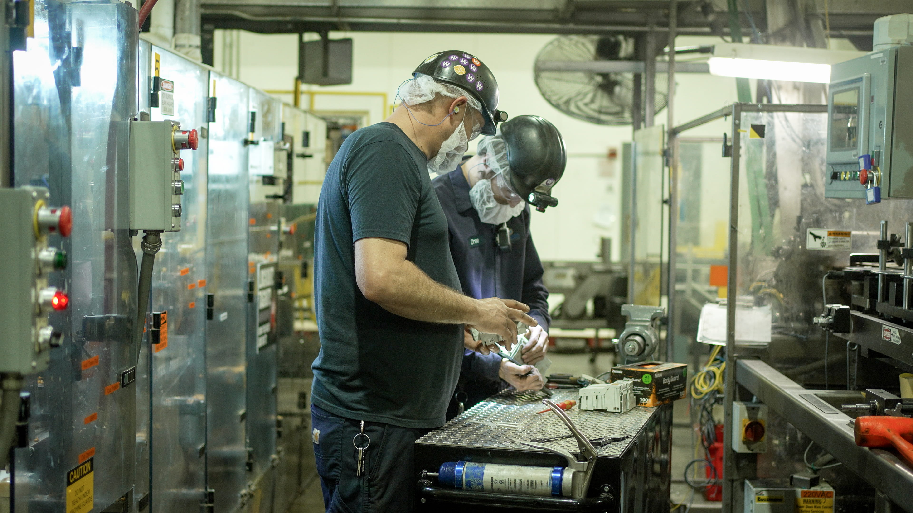 Two Employees Working on Project Together Two Employees Working on Project Together